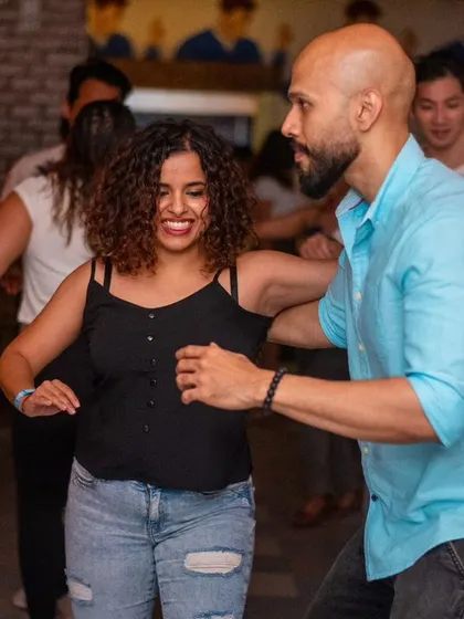 A close and connected dance with smiles all around.