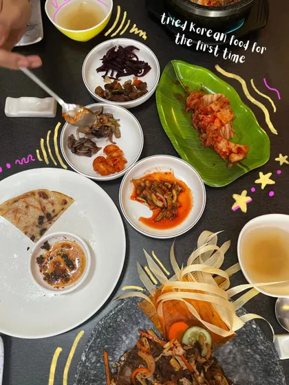 My first time trying Korean food. The doodles and stars capture my excitement and the variety of dishes.