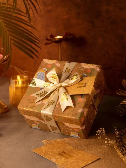 Our hexagonal gift box from the 2024 Diwali collection, all wrapped up and ready to impress. The unique shape and custom ribbon make it stand out.