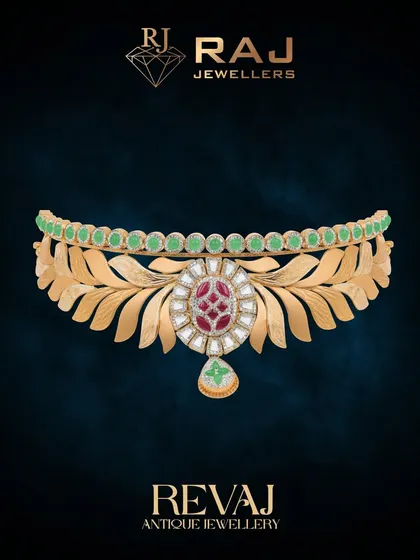 This elegant Revaj choker features a band of stylized golden leaves, centered by a floral medallion with polki and red stones. The row of green beads along the top adds a beautiful contrast, making it a sophisticated and nature-inspired piece.