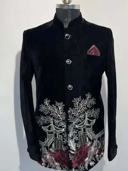 A unique black velvet Jodhpuri featuring an embroidered landscape with Japanese-style pagodas and trees. This is a perfect example of how we can turn a personal idea into wearable art.