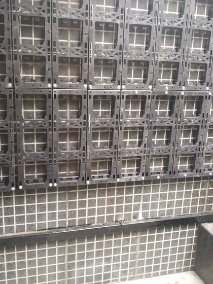 A closer look at the vertical garden panel system being installed on a wall. This durable structure is the foundation for a long-lasting and healthy living wall.