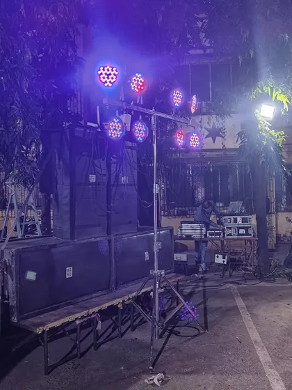 The Kojagiri event setup at night, with the colorful LED lights creating a festive mood. I can program the lights to match the music and the vibe of the event.