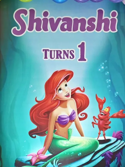 A close-up of the main backdrop featuring Ariel from The Little Mermaid for Shivanshi's first birthday.
