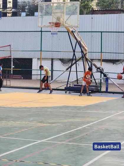 Young players practice their dribbling skills on the basketball court during our Matunga sports camp. We provide a great environment for kids to learn and enjoy the game.