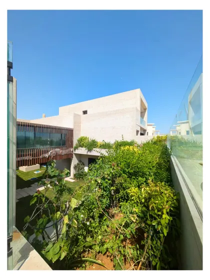 A view into the green heart of our Dubai Hills villa. The design brings the lushness of the adjacent golf course right into the home's courtyard, creating a true oasis in the desert landscape.