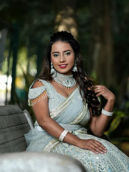 A beautiful portrait of a client in her custom grey lehenga, complete with diamond jewelry.