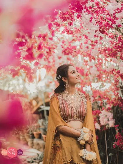 A bride framed by blossoms, looking towards her future. Our bridal portrait sessions are about more than just a beautiful photo; they are about capturing the soul of the woman at the heart of the story.
