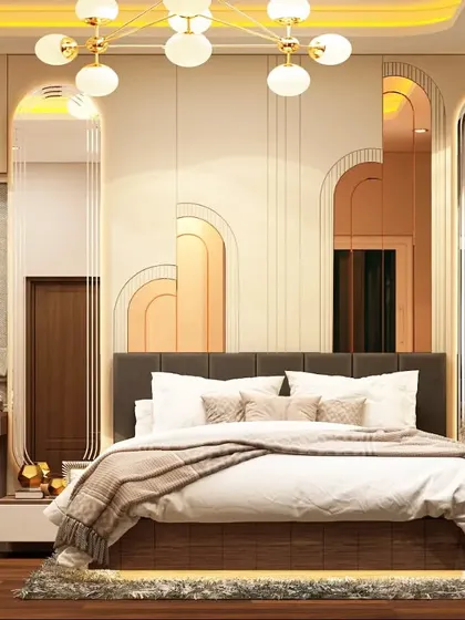 We used geometric forms and reflective surfaces to create this chic bedroom. The wall behind the bed features a series of layered, backlit arches in peach and gold tones, adding depth and a soft, ambient glow.