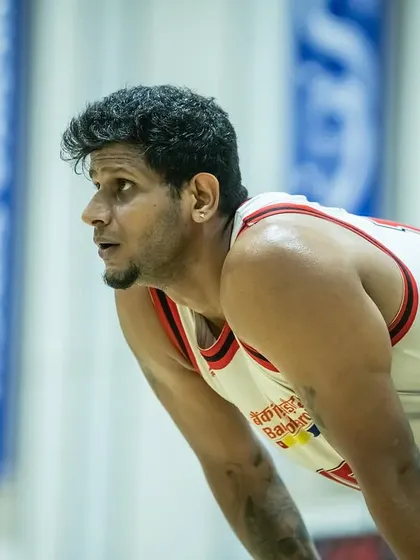 Focus and determination. A player from the opposing team catches his breath during a timeout. These matches are a true test of endurance.