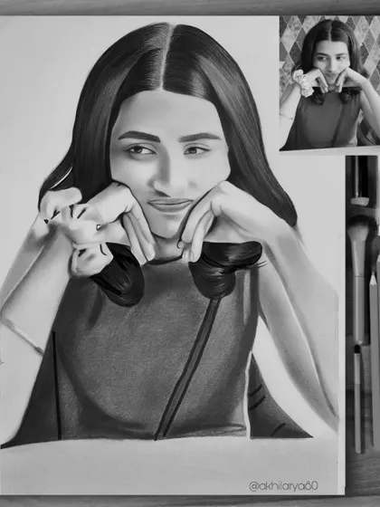 This A4 graphite sketch captures a playful and thoughtful pose. The black and white medium helps to focus on her expression and the mood of the photo.