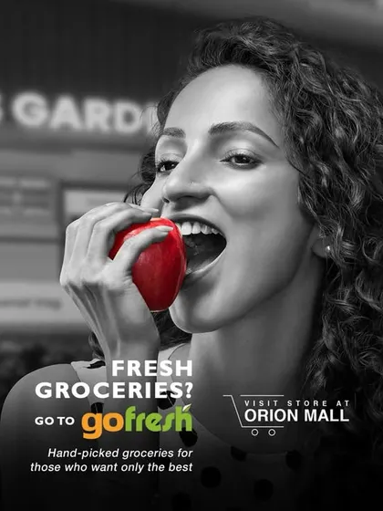 A print ad for GoFresh, using the same color pop concept with a red apple. The styling is simple and clean, focusing on the freshness of the produce.