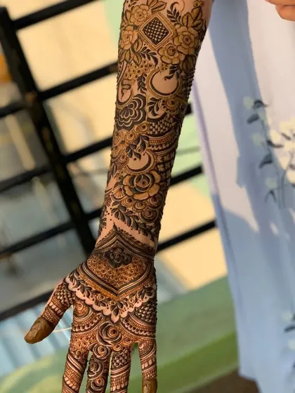 Another view of the same full arm design, highlighting the delicate shading and line work involved.
