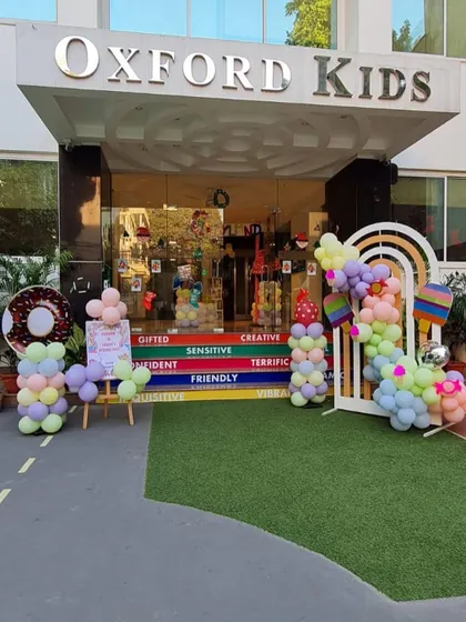Our venue's entrance transformed into a Candyland dream, with a donut-themed welcome sign and candy-inspired decorations.