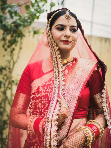 A classic bridal portrait of Aditi, showcasing her elegance and the rich details of her wedding attire.