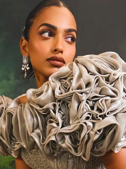 This is the sculptural 3D cape of my Bellerose Gown. I crafted each rose by hand to create a dramatic, blooming effect that is a true work of wearable art.