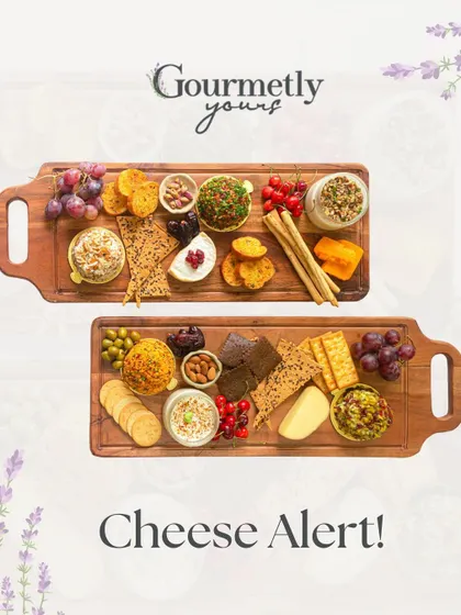 Cheese Alert! This image showcases two of our beautiful cheese boards, featuring a variety of our unique cheese domes, crackers, fruits, and nuts.