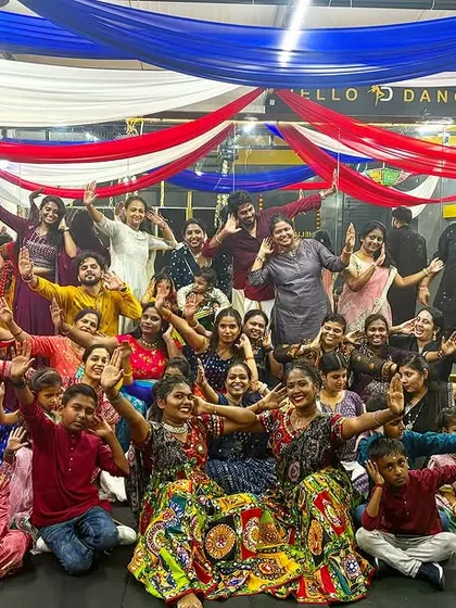 The whole dance family waving with joy after an amazing Dandiya celebration. These are the moments we cherish.