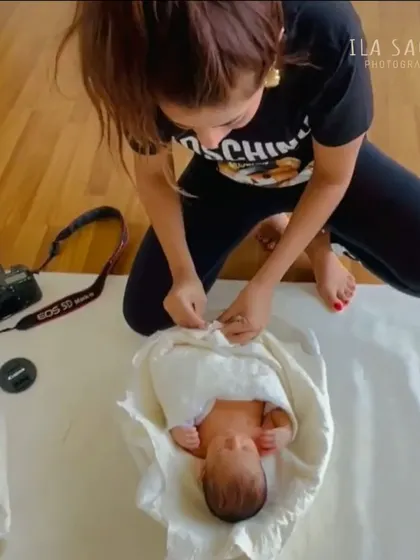 A snapshot of me in my element, carefully wrapping a newborn to keep them warm and secure. This gentle swaddling is key to a peaceful newborn session.