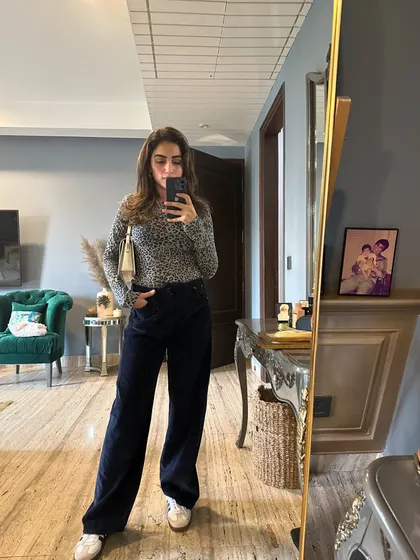 A cozy fall look with an animal print sweater and corduroy pants.