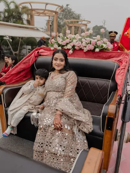 The sister of the groom and her son making their entrance in a decorated carriage. I styled her in a gorgeous mirror-work lehenga that was both glamorous and comfortable, proving that you never have to compromise on style.