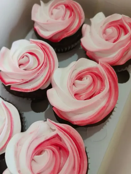 These two-tone rosette cupcakes are simple, elegant, and so pretty. The blend of pink and white frosting off creates a beautiful floral effect, perfect for a baptism or bridal shower.
