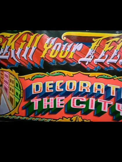 A detailed shot focusing on the typography of "Decorate The City," showing the multi-colored 3D effect.