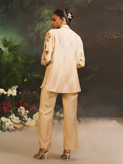 The back view of the beige Lunara Co-Ord Set, highlighting the clean tailoring and modern silhouette.