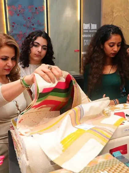 A client explores the vibrant colors and patterns of a Missoni Home fabric at our booth during the Ajio Luxe Weekend. It's always a joy to see guests connect with the textiles.