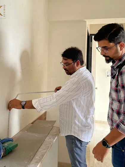 Precision is everything. Here, we are taking exact measurements on-site to ensure that every piece of custom furniture and every design element fits perfectly.
