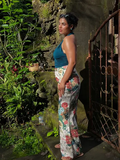 This Barbie is not made for laptops and 9-5s. Exploring the lush greenery of Ubud in floral pants and a teal halter top. This is a great example of a comfortable yet stylish outfit for a day of sightseeing.