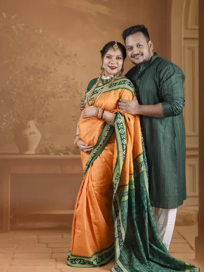 A full-length portrait showcasing the couple in elegant traditional wear. This shot captures their grace and the cultural significance of the moment.