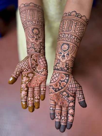 A beautiful bridal design with lotus mandalas and floral bands.