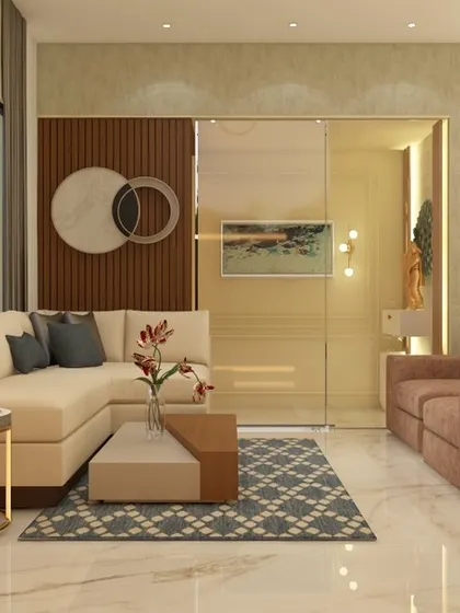 A modern living room design featuring an L-shaped sofa and a mix of neutral tones. The space is defined by a textured accent wall behind the seating area and a sliding glass partition leading to an adjacent room.