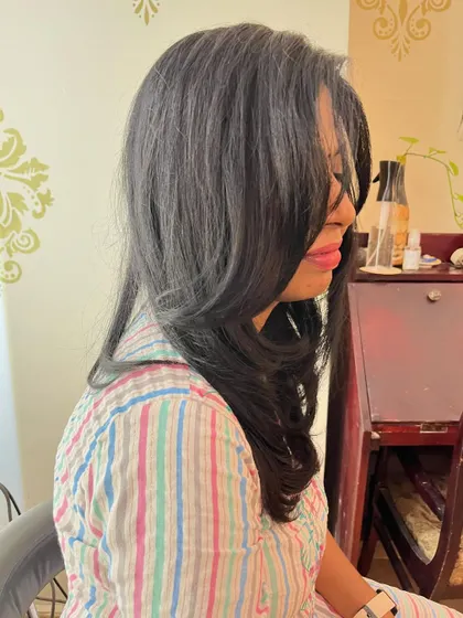 The side view shows the soft, feathered texture.
