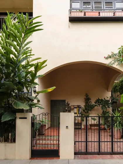 The entrance to Casa 503, where an arched portico and lush greenery welcome you into a serene, Spanish-inspired world. This is one of our most photogenic and loved homes.