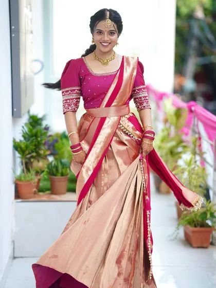 The movement in this photo showcases the beautiful drape of the half saree. The makeup remains flawless, highlighting how my techniques ensure longevity and a picture-perfect finish.