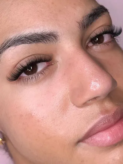 A happy client selfie is the best compliment. She looks absolutely radiant with her new lashes.