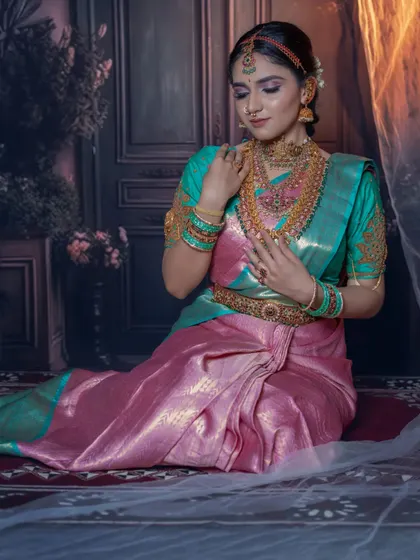 A serene and graceful pose. The makeup is soft and romantic, with a focus on creating a dreamy look that is perfect for wedding portraits.
