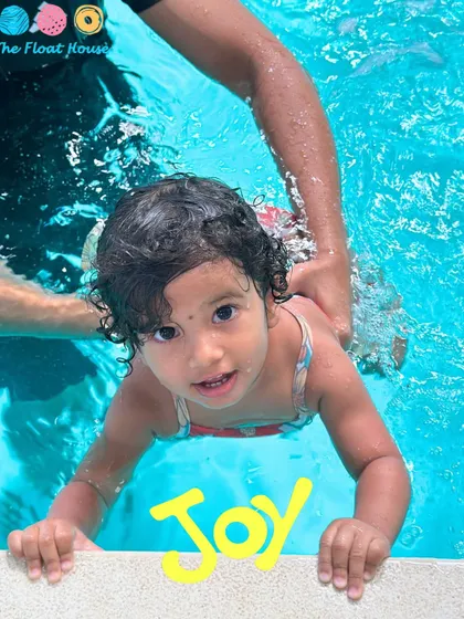 The pure joy on this little swimmer's face says it all. We focus on creating positive first experiences in our warm, ozonized pool.