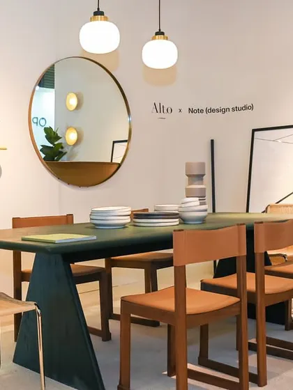 The Conica Dining Table in a showroom setting, paired with our Tan Side Chairs. This arrangement, part of our collaboration with Note Design Studio, showcases a shared vision for innovative design and exceptional craftsmanship.