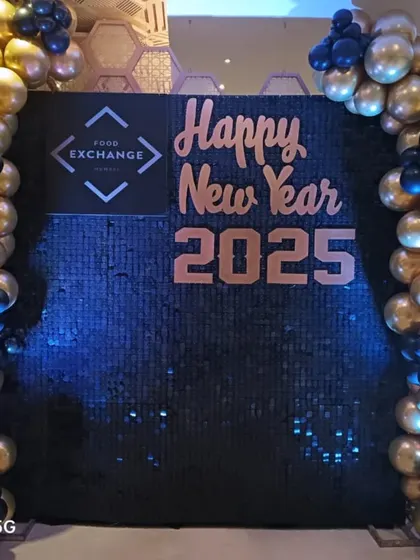 This is another corporate New Year's Eve setup, designed for 'Food Exchange'. I used a black sequin wall to make the rose gold lettering and company logo pop, with blue and gold balloons adding to the celebration.