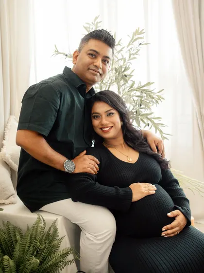 A relaxed and happy portrait of a couple in my boho-chic studio. My sessions are all about capturing you as you are, celebrating your connection in a comfortable setting.