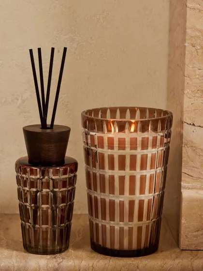 Here is the true essence of royalty captured in my Royal Mirage collection. The rich brown cut-glass vessel with its geometric pattern adds a warm, ambient light to any corner, making it a perfect piece for elegant home styling and festive decor.