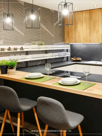 This kitchen features a breakfast bar with comfortable seating, perfect for casual meals. The design combines wood, dark countertops, and industrial-style pendant lights.