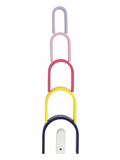 A tower made from stacking the pieces of a wooden pastel arch toy.