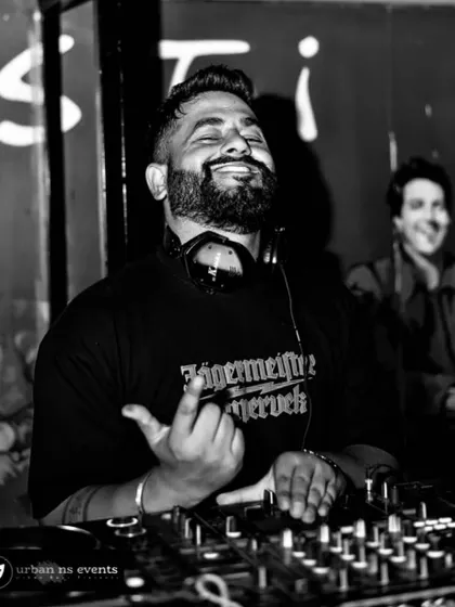 A cool black and white shot, feeling the music. The Jagermeister shirt adds to the party vibe.