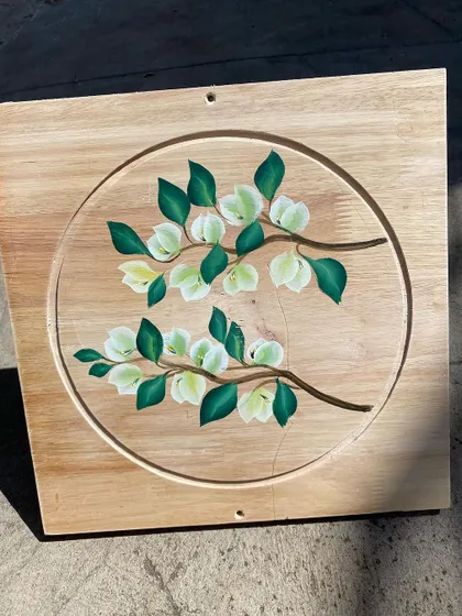 Delicate white blossoms on branches, demonstrating the fine detail that can be achieved with the one-stroke painting technique.