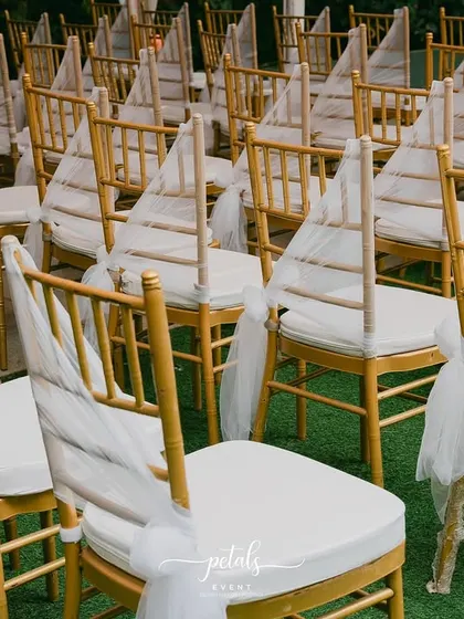 The Tiffany chairs for the Nalugu ceremony are adorned with elegant cross-bow detailing, adding a touch of sophistication to the overall aesthetic.