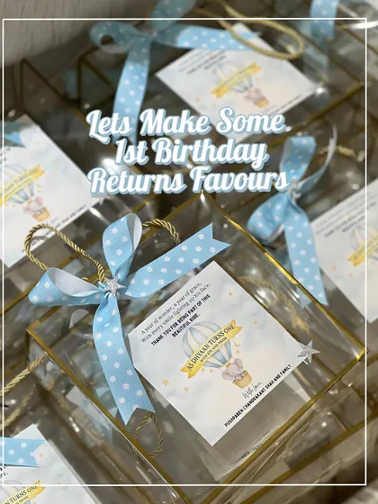 Assembling first birthday return favors is one of my favorite things to do. These transparent bags with custom tags and ribbons look so magical when they all come together.